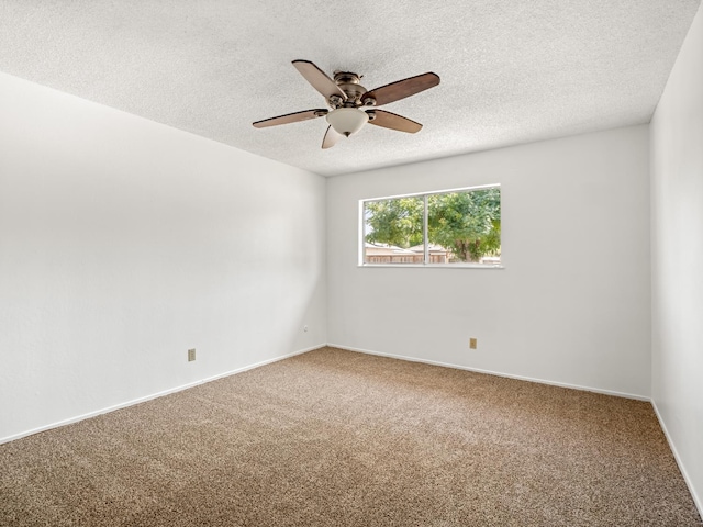 6413 N 5th St, Fresno, CA 93710 - empty room with carpet flooring, ceiling fan, a textured ceiling, and baseboards
