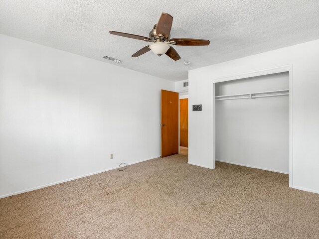 6413 N 5th St, Fresno, CA 93710 - unfurnished bedroom with carpet floors, a closet, a textured ceiling, and ceiling fan