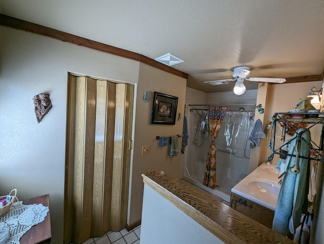 51410 Wildmint Ln, Yokuts Valley, CA 93675 - full bath featuring tile patterned flooring, a textured ceiling, ceiling fan, a skylight, and vanity