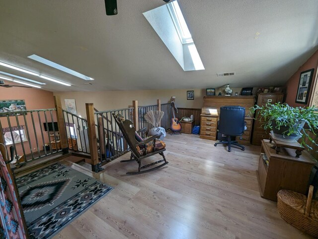 51410 Wildmint Ln, Yokuts Valley, CA 93675 - office area featuring a skylight, light wood-style floors, and a textured ceiling