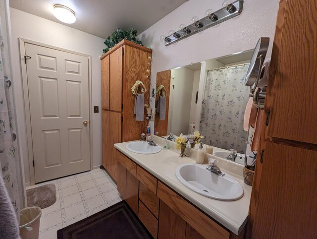 51410 Wildmint Ln, Yokuts Valley, CA 93675 - bathroom featuring tile patterned floors and double vanity
