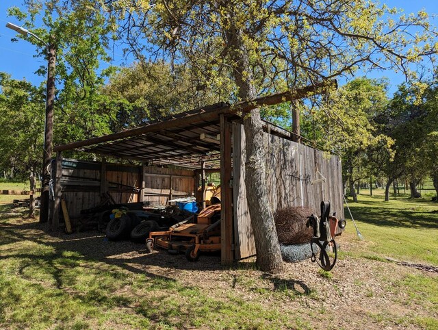 51410 Wildmint Ln, Yokuts Valley, CA 93675 - view of pole building featuring a yard and a detached carport