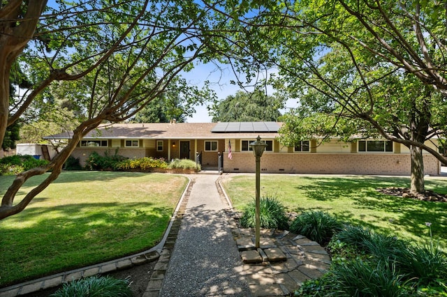 5835 E Hamilton Ave, Fresno, CA 93727 - ranch-style home with brick siding, solar panels, crawl space, and a front lawn