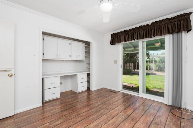 5835 E Hamilton Ave, Fresno, CA 93727 - unfurnished office with built in desk, ornamental molding, dark wood-type flooring, ceiling fan, and baseboards