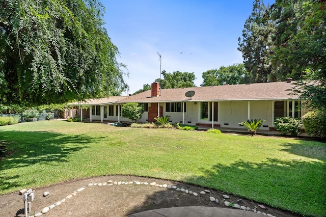 5835 E Hamilton Ave, Fresno, CA 93727 - view of front of house with a chimney and a front lawn