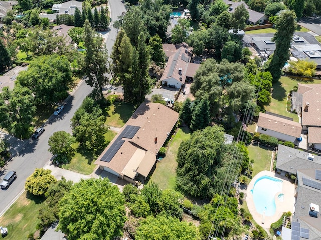 5835 E Hamilton Ave, Fresno, CA 93727 - aerial overview of property's location featuring nearby suburban area, a pool, and a tree filled landscape