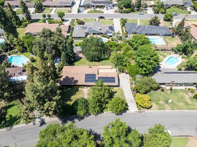 5835 E Hamilton Ave, Fresno, CA 93727 - aerial overview of property's location with a pool area and nearby suburban area