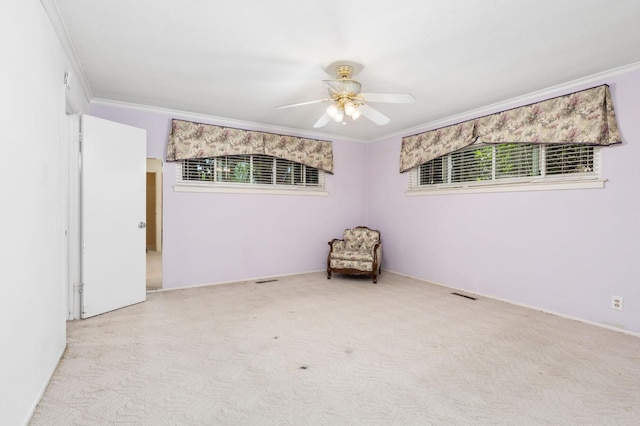 5835 E Hamilton Ave, Fresno, CA 93727 - spare room featuring ornamental molding, carpet, and a ceiling fan