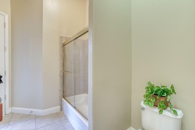 1223 E Rosemont Ln, Fresno, CA 93730 - bathroom with toilet, tile patterned floors, shower / bath combination with glass door, and baseboards