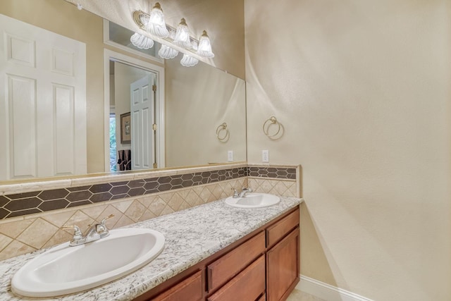 1223 E Rosemont Ln, Fresno, CA 93730 - full bathroom with decorative backsplash, double vanity, and baseboards