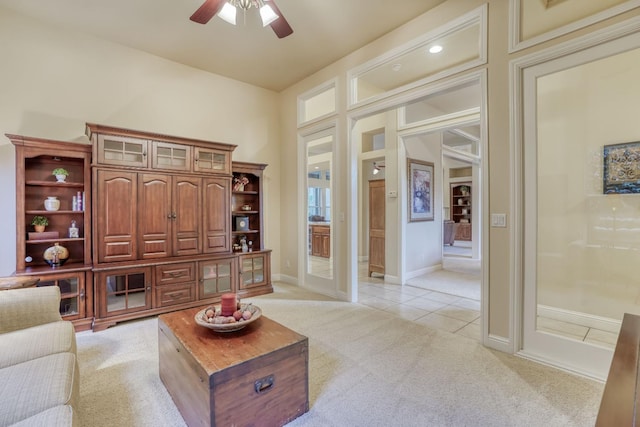 1223 E Rosemont Ln, Fresno, CA 93730 - living area with light carpet, ceiling fan, light tile patterned flooring, and baseboards