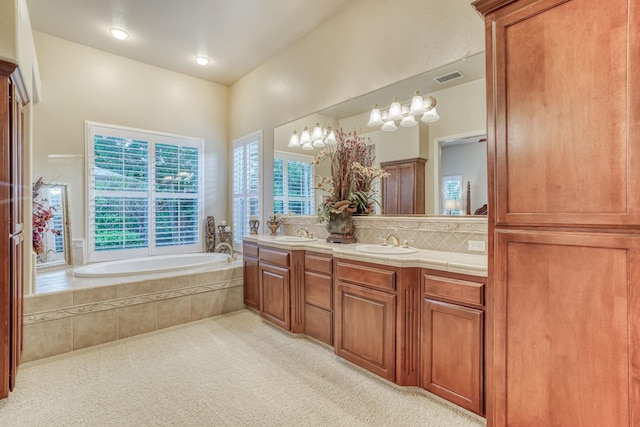 1223 E Rosemont Ln, Fresno, CA 93730 - full bath featuring double vanity, a bath, and tasteful backsplash