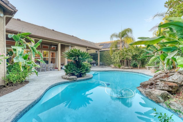 1223 E Rosemont Ln, Fresno, CA 93730 - swimming pool featuring a patio and outdoor dining area