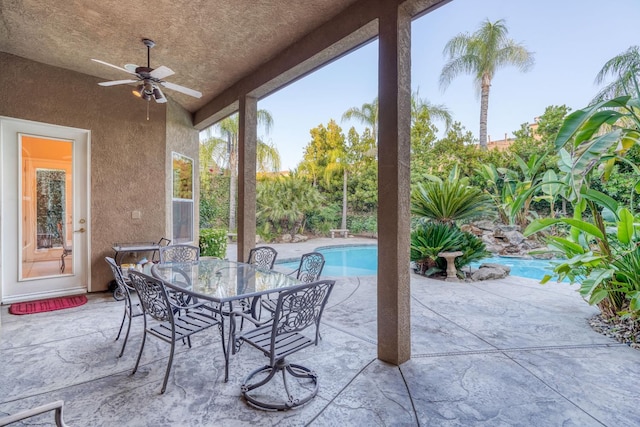 1223 E Rosemont Ln, Fresno, CA 93730 - view of patio featuring ceiling fan, an outdoor pool, and outdoor dining area