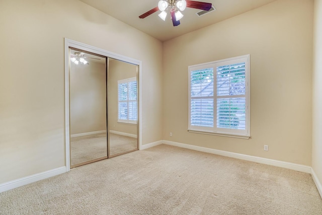 1223 E Rosemont Ln, Fresno, CA 93730 - unfurnished bedroom featuring carpet floors, baseboards, a closet, and ceiling fan