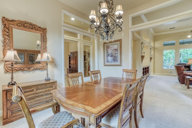 1223 E Rosemont Ln, Fresno, CA 93730 - dining room with light carpet, a chandelier, ornamental molding, baseboards, and ceiling fan