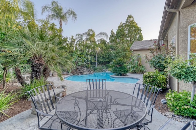 1223 E Rosemont Ln, Fresno, CA 93730 - outdoor pool with outdoor dining space and a patio area