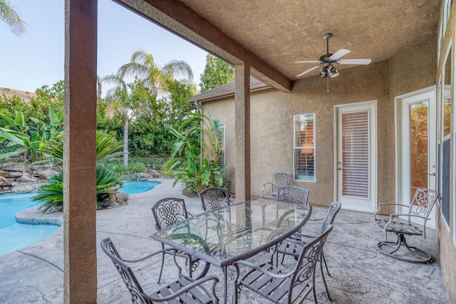 1223 E Rosemont Ln, Fresno, CA 93730 - view of patio / terrace featuring ceiling fan, an outdoor pool, and outdoor dining space