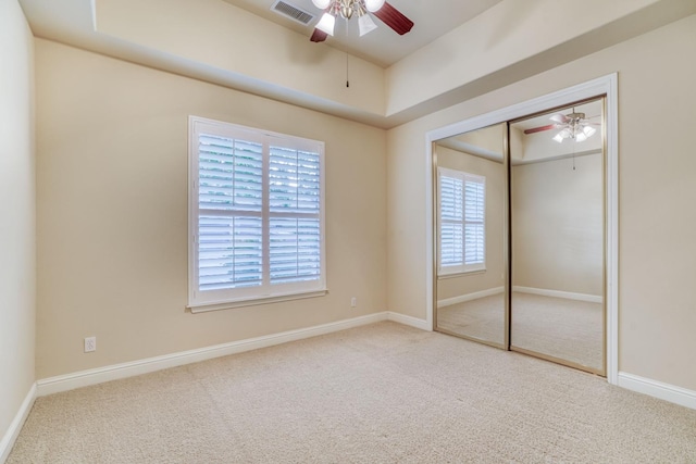 1223 E Rosemont Ln, Fresno, CA 93730 - unfurnished bedroom featuring carpet floors, a closet, a ceiling fan, and baseboards