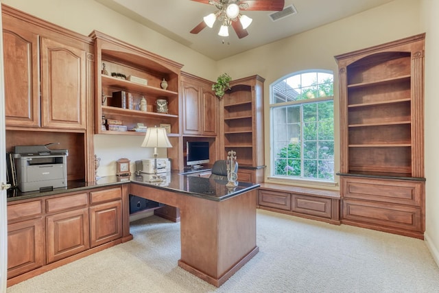 1223 E Rosemont Ln, Fresno, CA 93730 - office area featuring ceiling fan, built in study area, and light colored carpet