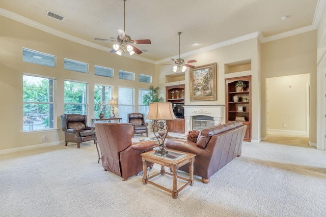 1223 E Rosemont Ln, Fresno, CA 93730 - living room with baseboards, light carpet, ornamental molding, a ceiling fan, and a glass covered fireplace