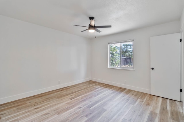 3678 N 7th St, Fresno, CA 93726 - spare room with a ceiling fan, light wood-style floors, and baseboards
