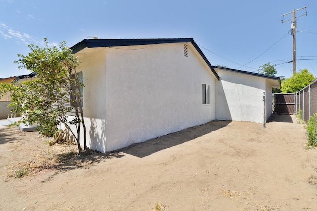 3678 N 7th St, Fresno, CA 93726 - view of home's exterior featuring stucco siding