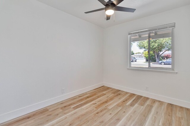 3678 N 7th St, Fresno, CA 93726 - unfurnished room featuring baseboards, wood finished floors, and ceiling fan