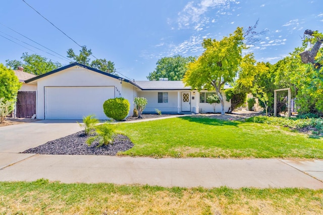 3678 N 7th St, Fresno, CA 93726 - single story home featuring an attached garage, driveway, and a front lawn