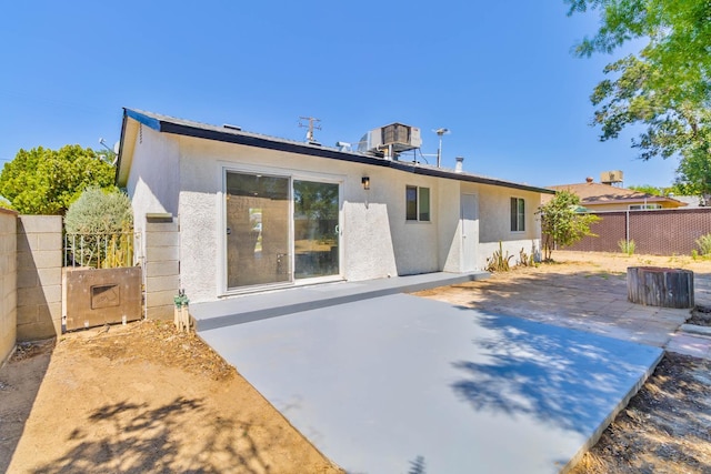 3678 N 7th St, Fresno, CA 93726 - back of house featuring stucco siding and a patio area