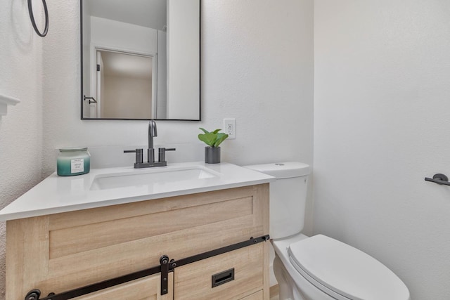 3678 N 7th St, Fresno, CA 93726 - half bathroom featuring toilet and vanity
