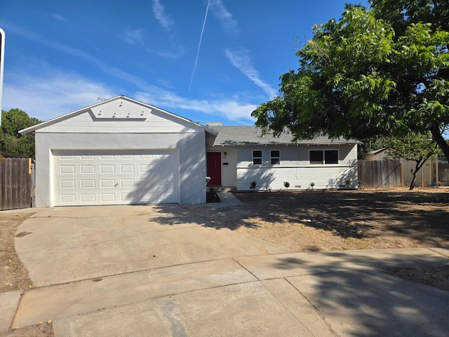 2018 E Pico Ave, Fresno, CA 93726 - single story home with concrete driveway, an attached garage, and stucco siding