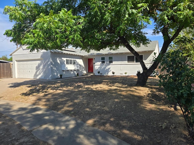 2018 E Pico Ave, Fresno, CA 93726 - view of front facade with solar panels, concrete driveway, and a garage