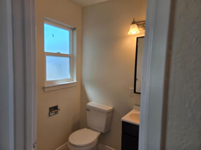2018 E Pico Ave, Fresno, CA 93726 - half bath with vanity, plenty of natural light, toilet, and baseboards