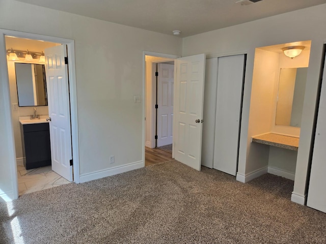 2018 E Pico Ave, Fresno, CA 93726 - unfurnished bedroom with baseboards, a closet, carpet, and connected bathroom