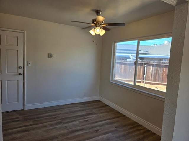 2018 E Pico Ave, Fresno, CA 93726 - unfurnished room with baseboards, dark wood-style floors, and a ceiling fan