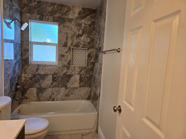 2018 E Pico Ave, Fresno, CA 93726 - bathroom featuring toilet, vanity, marble look tile flooring, and washtub / shower combination
