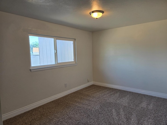 2018 E Pico Ave, Fresno, CA 93726 - empty room featuring dark carpet and baseboards
