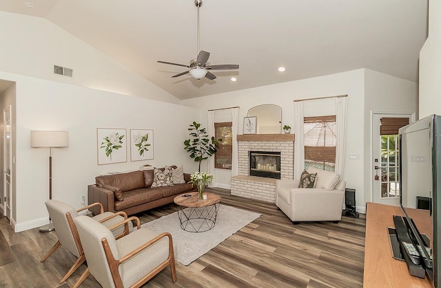 736 N Dartmouth Ave, Clovis, CA 93611 - living room with lofted ceiling, plenty of natural light, a ceiling fan, wood finished floors, and a fireplace