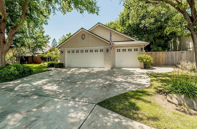 736 N Dartmouth Ave, Clovis, CA 93611 - single story home with concrete driveway, brick siding, and an attached garage