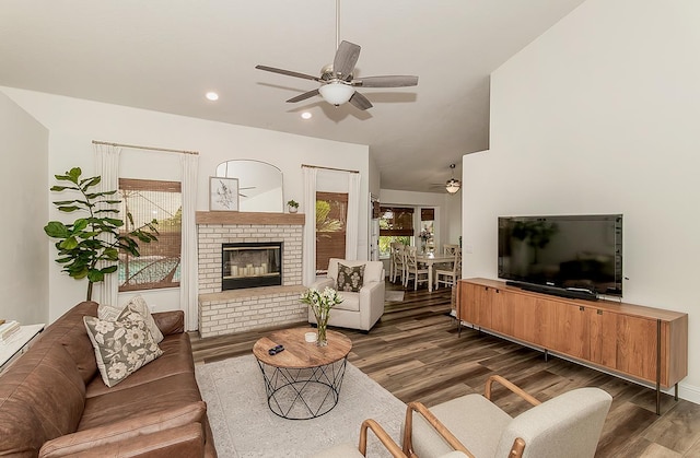 736 N Dartmouth Ave, Clovis, CA 93611 - living room with a ceiling fan, dark wood finished floors, healthy amount of natural light, a fireplace, and vaulted ceiling