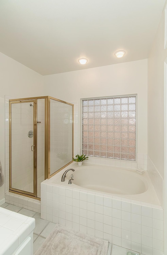 736 N Dartmouth Ave, Clovis, CA 93611 - bathroom with a garden tub, a stall shower, tile patterned floors, and vanity
