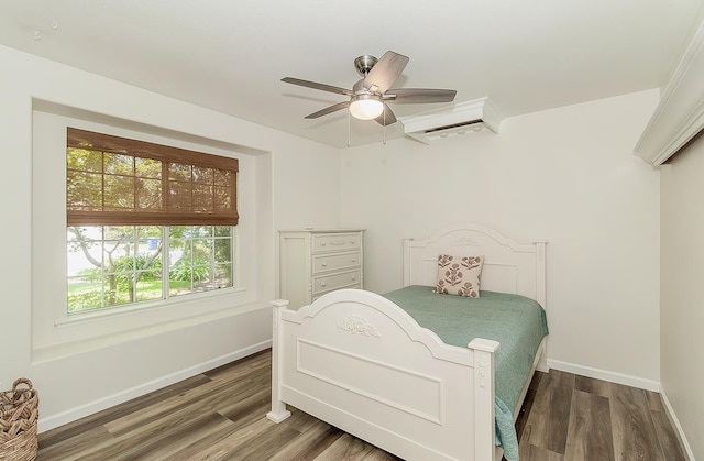 736 N Dartmouth Ave, Clovis, CA 93611 - bedroom with wood finished floors, baseboards, a wall mounted AC, and ceiling fan