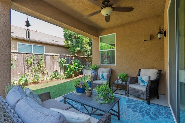 3675 Trenton Ln, Clovis, CA 93619 - fenced backyard featuring ceiling fan, an outdoor hangout area, and a patio