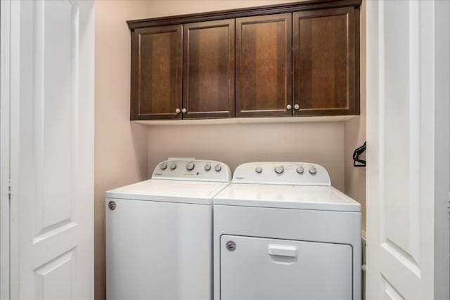 3675 Trenton Ln, Clovis, CA 93619 - washroom with washer and clothes dryer and cabinet space