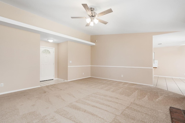 6051 N Tracy Ave, Fresno, CA 93722 - tiled spare room featuring carpet, a ceiling fan, and baseboards
