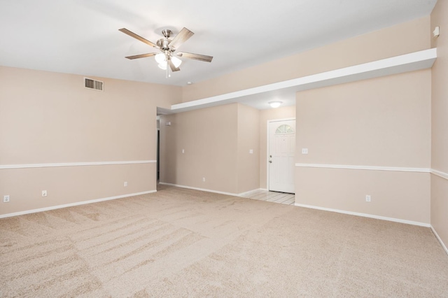 6051 N Tracy Ave, Fresno, CA 93722 - spare room featuring ceiling fan, light carpet, and baseboards