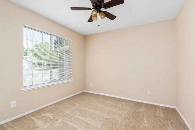 6051 N Tracy Ave, Fresno, CA 93722 - unfurnished room featuring carpet floors, baseboards, and ceiling fan