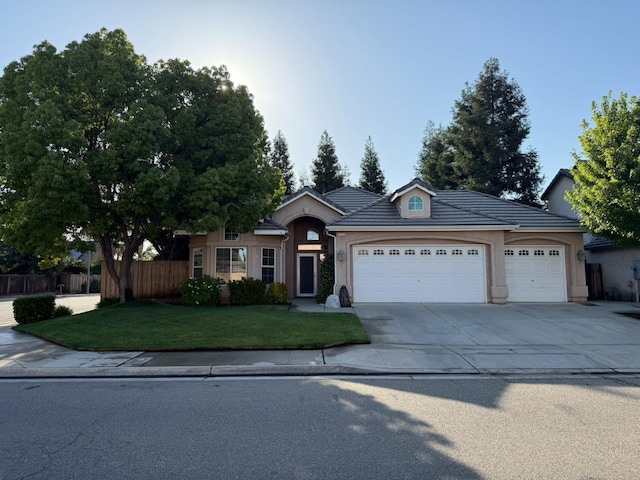 9850 N Winery Ave, Fresno, CA 93720 - ranch-style home with an attached garage, concrete driveway, and stucco siding