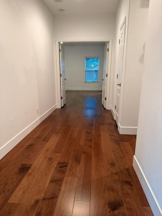9850 N Winery Ave, Fresno, CA 93720 - hallway with dark wood-style floors and baseboards